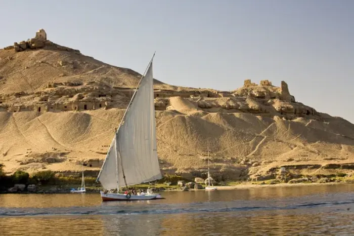 Framed Print : EGYPT, Aswan. The rock-hewn Tombs of the Nobles pock mark the West bank of the Nile