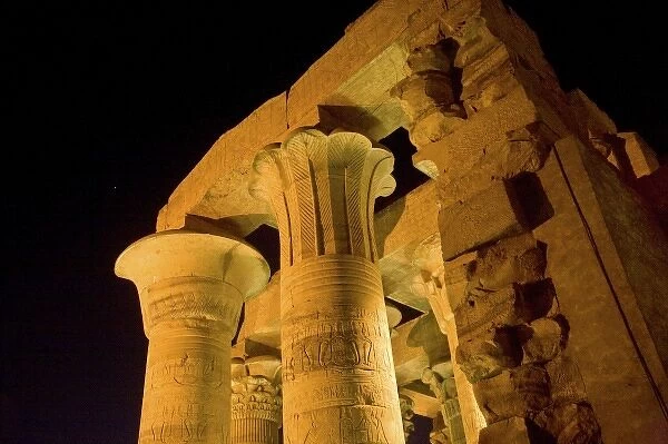 Egypt, Kom Ombo. Illuminated ruins and columns of 2nd Century BC Kom Ombo Temple