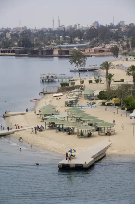 Framed Print : Egypt, Suez Canal. Beachfront resort along the canal