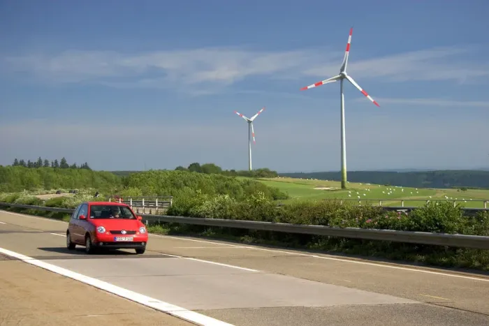 Framed Print : Electricity wind generators and automobiles traveling on the autobahn in northwest
