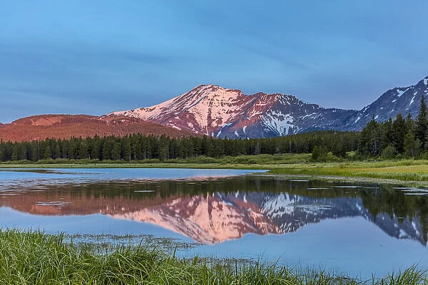 Elk Mountain reflects into Three Bears Lake at Marias Pass in Glacier National Park