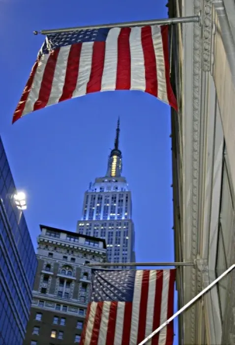 Framed Print : Empire State Building framed by American flag at dusk New York City