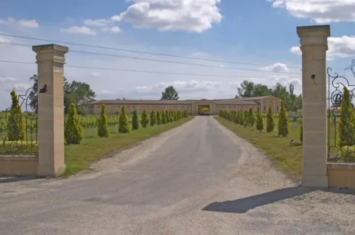 Framed Print : The back entrance to the Chateau Haut Bertinerie with gate posts and a tree lined