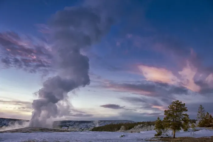 Framed Print : Eruption of Old Faithful Geyser after Sunset. Yellowstone National Park. Wyoming