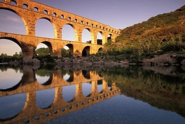 EU, France, Provence, Gard, Pont du Gard. Roman aqueduct  /  bridge in sunset light