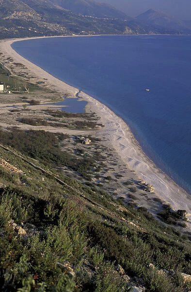 Europe, Albania. Coastal Road, sandy beach dotted by anti-aircraft military concrete
