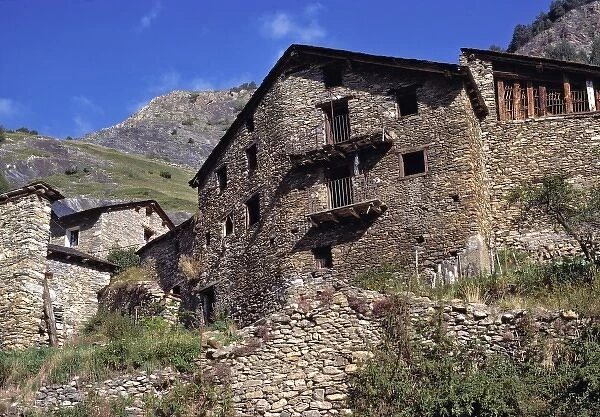 Europe, Andorra. Crumbling stone walls dot the hillsides in Andorra