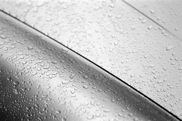 Europe, Austria, Salzburg. Water drops on silver car