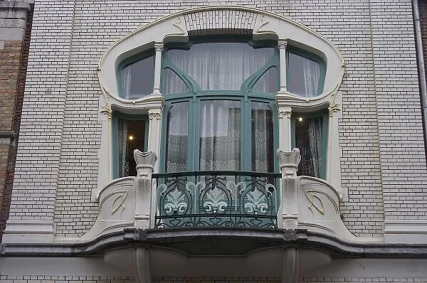Europe, Belgium, Antwerp. An ornate window in a home in Antwerps historic Zurenborg