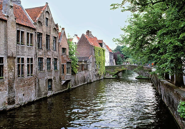 Europe, Belgium, Brugge. Old stone homes line the canals in Brugge, a World Heritage Site