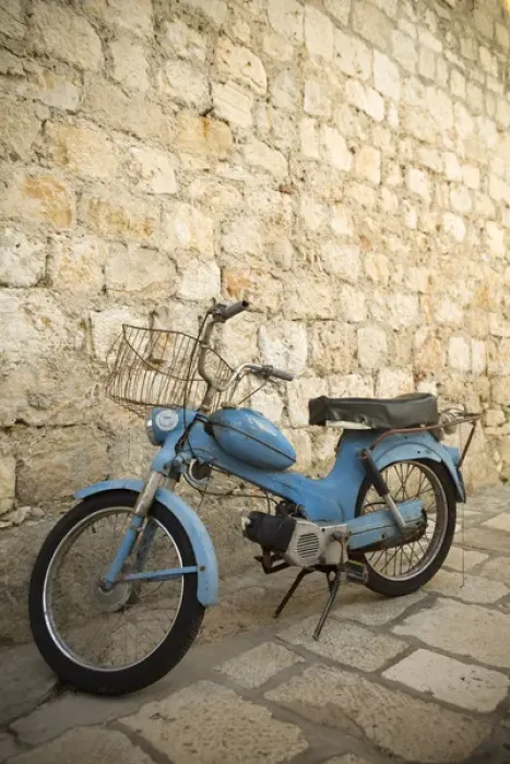 Framed Print : Europe, Croatia, Dalmatia, Hvar Island, Hvar town, blue scooter bike by old stone wall