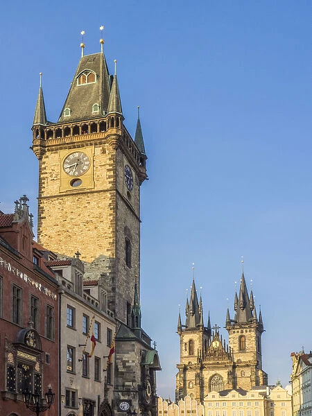 Europe, Czech Republic, Prague. Cityscape view on the clock tower and Tyn cathedral