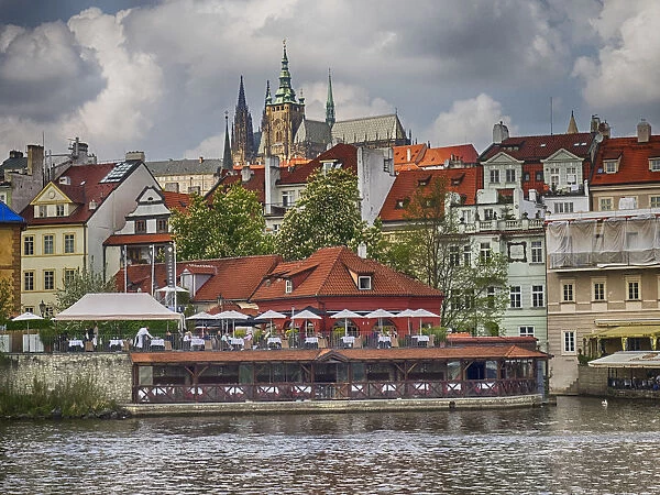 Europe, Czech Republic, Prague. Restaurant along the Vltava River from a riverboat