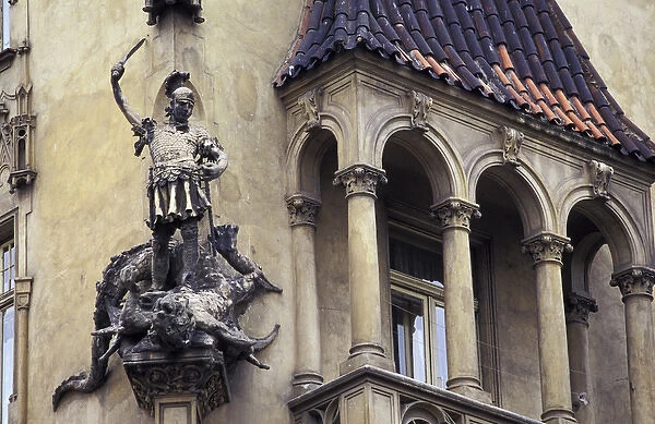 Europe, Czech Republic, Prague. Statue on old building with balcony
