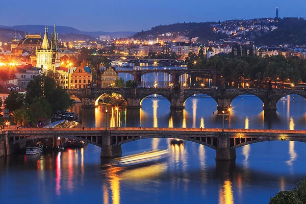 Europe, Czech Republic, Prague. Sunset on city and river bridges