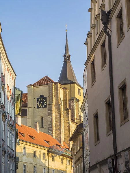 Europe, Czech Republic, Prague. View of steeple and clock in old town Prague