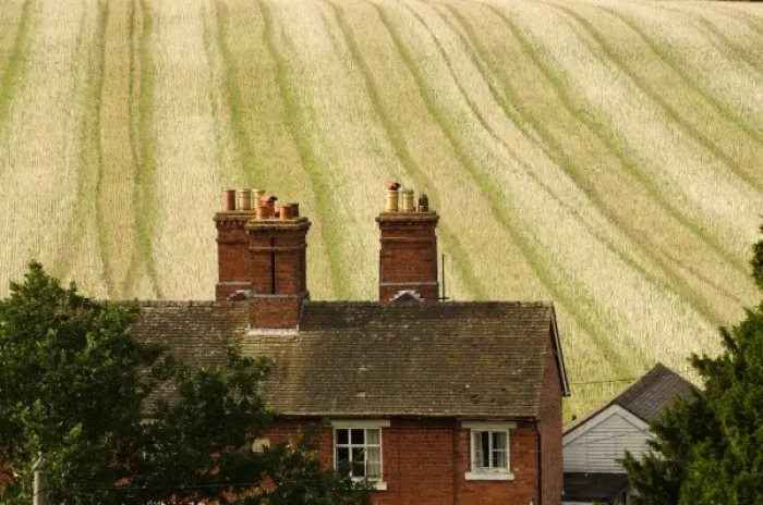 Framed Print : Europe, England, brick farmhouse in front of colourful field Framed Print : Europe, England, brick farmhouse in front of colourful field