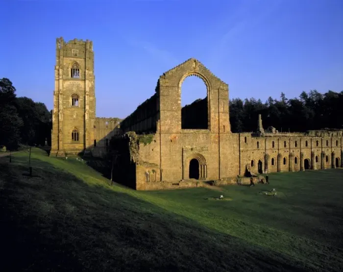 Framed Print : Europe, England, Fountains Abbey. Visitors roams among the stone ruins of Fountains Abbey