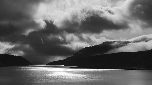 Europe, Faroe Islands. Black and White view of the fjord of Sundini between the islands