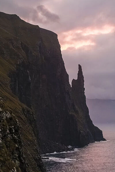 Europe, Faroe Islands. Morning view of Trollkonufingur, also known ass Witchs Finger