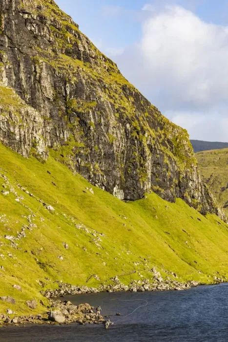Framed Print : Europe, Faroe Islands. View of fly fishermen casting on the island of Streymoy