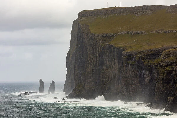 Europe, Faroe Islands. View during a storm of Eidiskollur