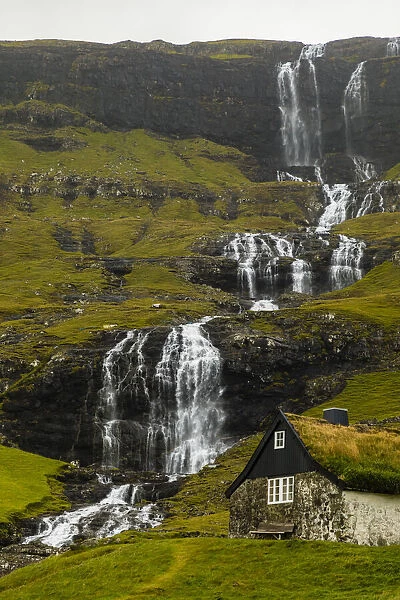 Europe, Faroe Islands. View of the village of Saksun and waterfalls on the island of