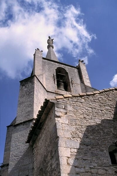Europe, France, Bonnieux. This 12th century church spire reaches for the sky in Bonnieux