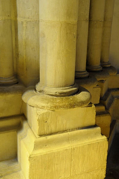 Europe, France, Burgundy, Nievre, Nevers. Stone column in yellow light, Nevers Cathedral