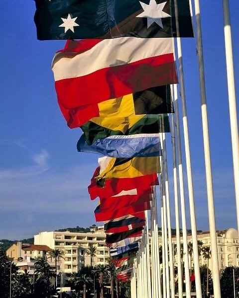 Europe, France, Cannes. Colorful flags line the Boulevard de la Croisette on the