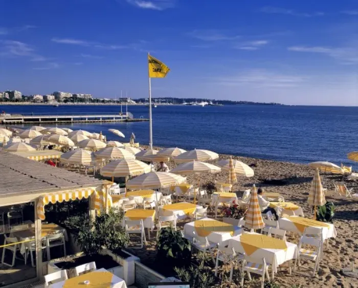 Framed Print : Europe, France, Cannes. The yellow stripped umbrellas on the beach at Cannes awaits Framed Print : Europe, France, Cannes. The yellow stripped umbrellas on the beach at Cannes awaits