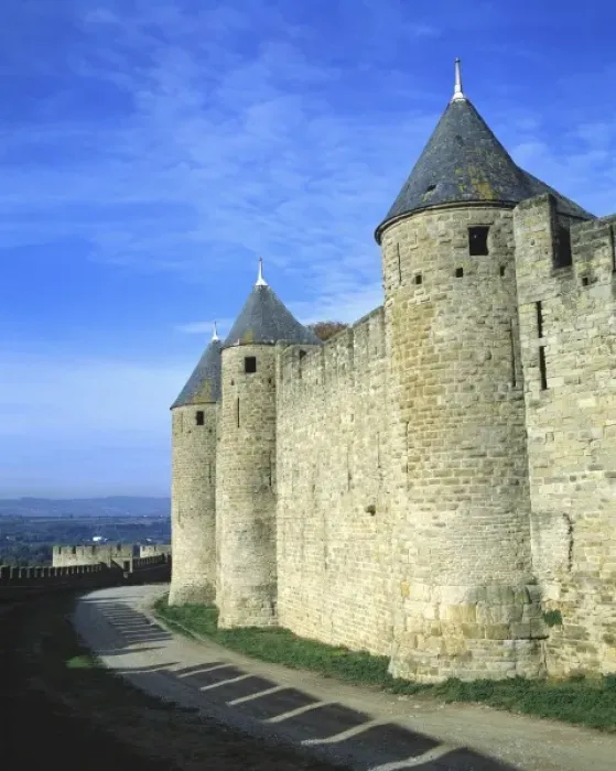 Framed Print : Europe, France, Carcassonne. Shadows of the crenelatted walls shade the pathway under
