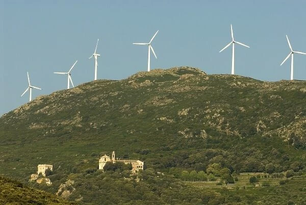 Europe, France, Corsica, Maccinagio. Blend of old and new with modern windpower turbines