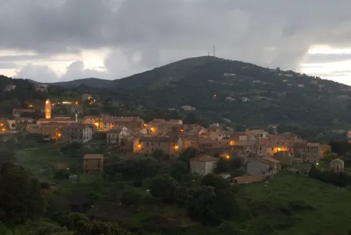 Framed Print : Europe, France, Corsica, Piana. Lights of Piana at dusk with storm clouds