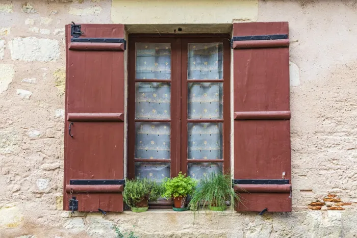 Framed Print : Europe, France, Dordogne, Hautefort. A brown shuttered window on a house in the town of Framed Print : Europe, France, Dordogne, Hautefort. A brown shuttered window on a house in the town of