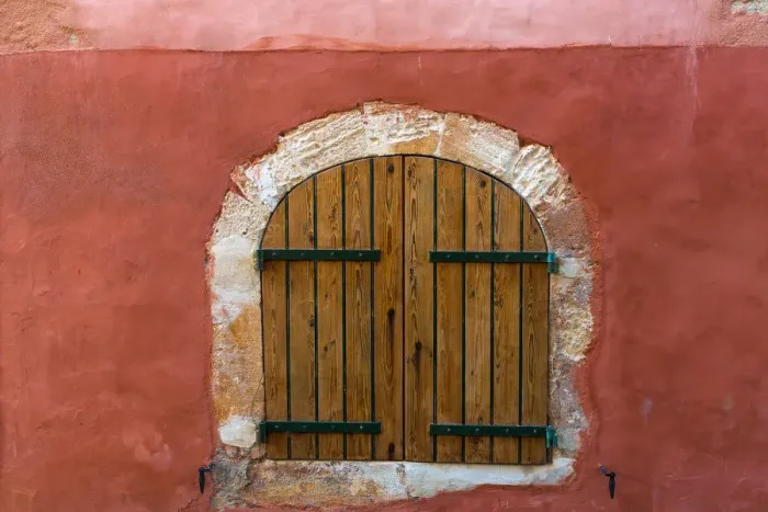 Framed Print : Europe, France, Provence, Roussillon. Wooden shutters in red wall Framed Print : Europe, France, Provence, Roussillon. Wooden shutters in red wall