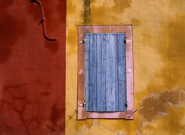 Europe, France, Roussillon. Blue shutters conceal a window in Roussillon, Provence