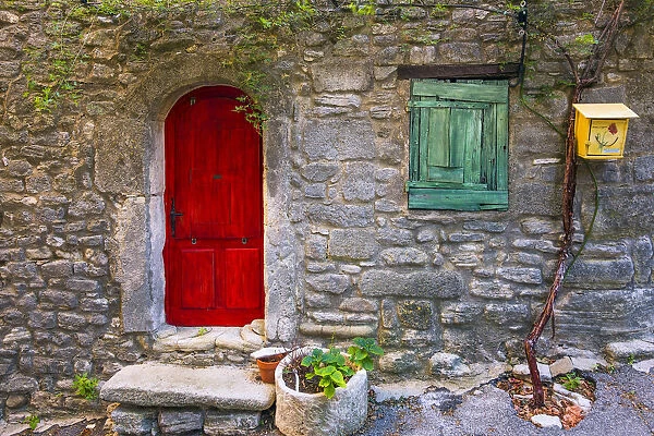 Europe, France, Saignon. Rustic stone house exterior