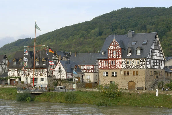 Europe, Germany, Hessen, Oberspay, Crusing past half timber houses along the Rhine
