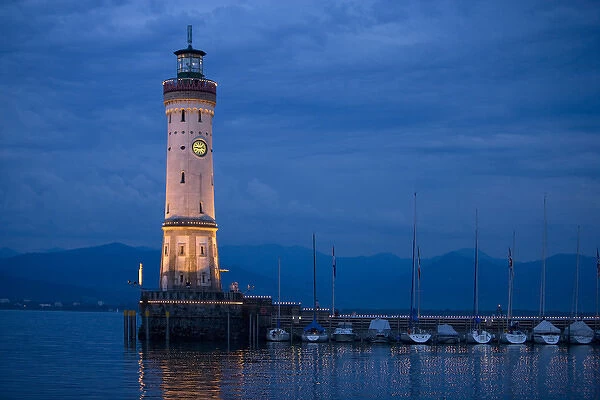 Europe, Germany, Lake Constance. View of lighthouse on Lindau Island at sunset. Credit as