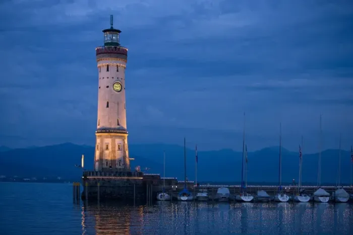 Framed Print : Europe, Germany, Lake Constance. View of lighthouse on Lindau Island at sunset. Credit as Framed Print : Europe, Germany, Lake Constance. View of lighthouse on Lindau Island at sunset. Credit as