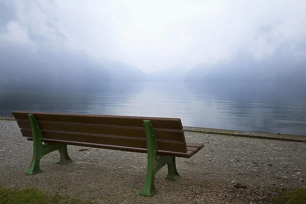 Europe, Germany, Lake Konigssee. Bench and lake in fog