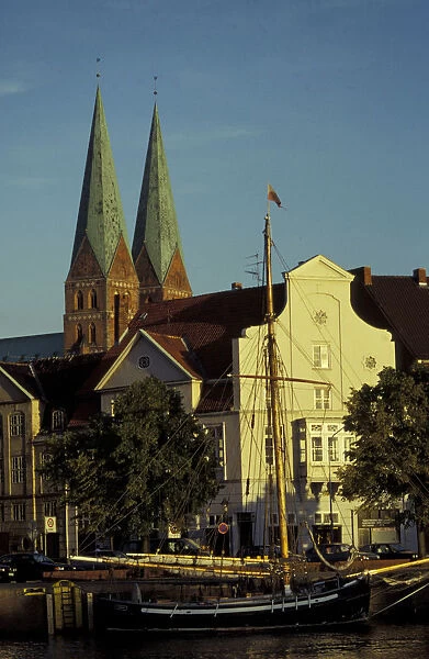 Europe, Germany, Lubeck. St. Marien church and twin towers behind houses facing the