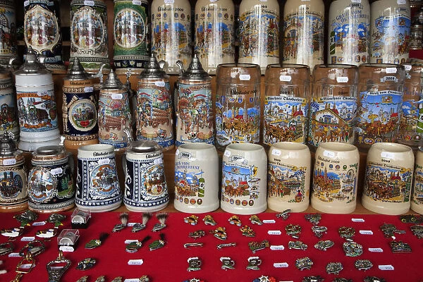Europe, Germany, Munich. Close-up of Oktoberfest steins and pins for sale. Credit as