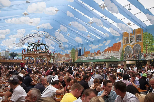 Europe, Germany, Munich. Revelers inside one of the many beer halls at Oktoberfest celebration