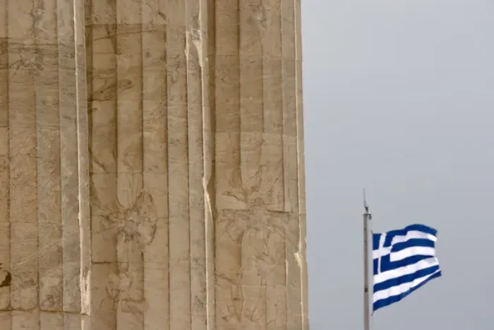 Framed Print : Europe, Greece, Athens, Acropolis. Three pillars of the Parthenon and the Greek flag