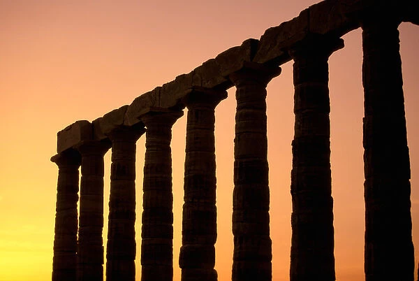Europe, Greece, Attica, Cape Sounion. Temple of Poseidon columns at sunset