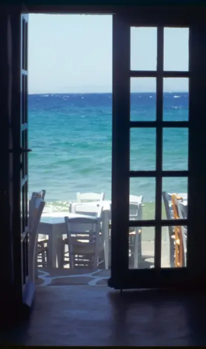 Framed Print : Europe, Greece, Cyclades, Island of Mykonos. View of ocean through restaurant door Framed Print : Europe, Greece, Cyclades, Island of Mykonos. View of ocean through restaurant door