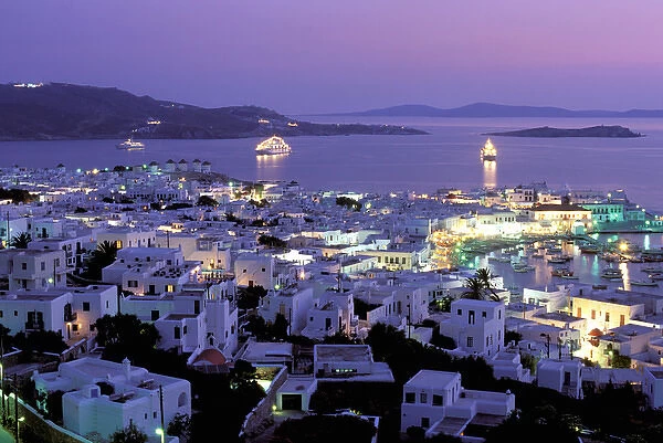Europe, Greece, Cyclades Islands, Mykonos. Evening view of Mykonos town from hillside