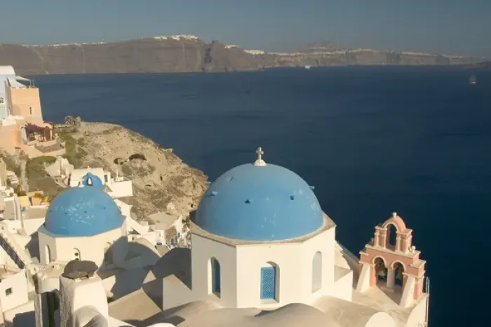 Framed Print : Europe, Greece, Cyclades, Santorini: the clifttop village of Oia overlooks the caldera
